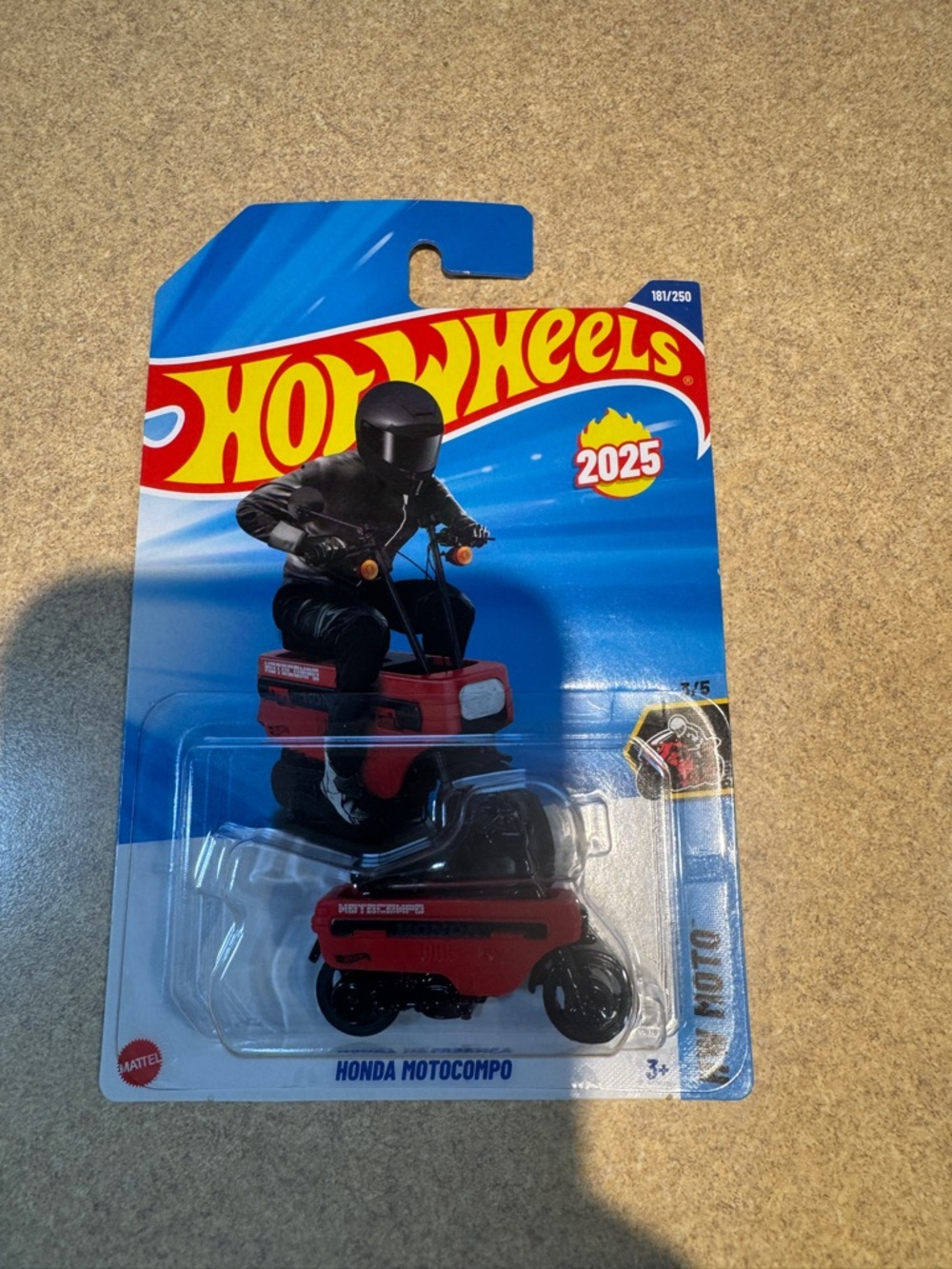 Die-cast Hot Wheels Honda Motocompo motorcycle with rider, 2025 HW Moto series